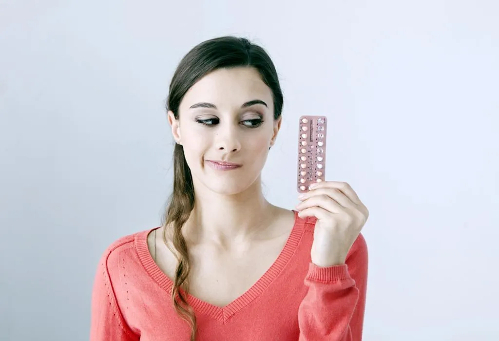 Low-dose birth control pills placed on a table alongside a stethoscope