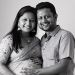 A happy Indian family planning their future